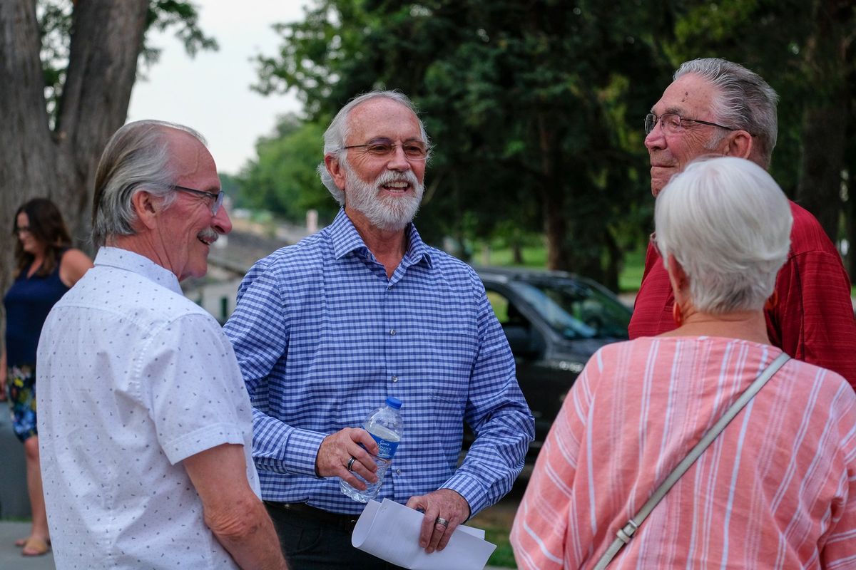 Rep. Dan Newhouse, R-Sunnyside, talks with supporters on Aug. 1 before a rally in Richland on Aug. 1 to oppose efforts to breach the Lower Snake River dams.  (Orion Donovan-Smith/The Spokesman-Review)