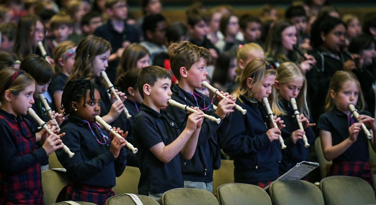 Cataldo Catholic School students play their recorders along with the Spokane Symphony during "link Up" program, Wednesday, April 26, 2023 in downtown Spokane.  (DAN PELLE/THE SPOKESMAN-REVIEW)