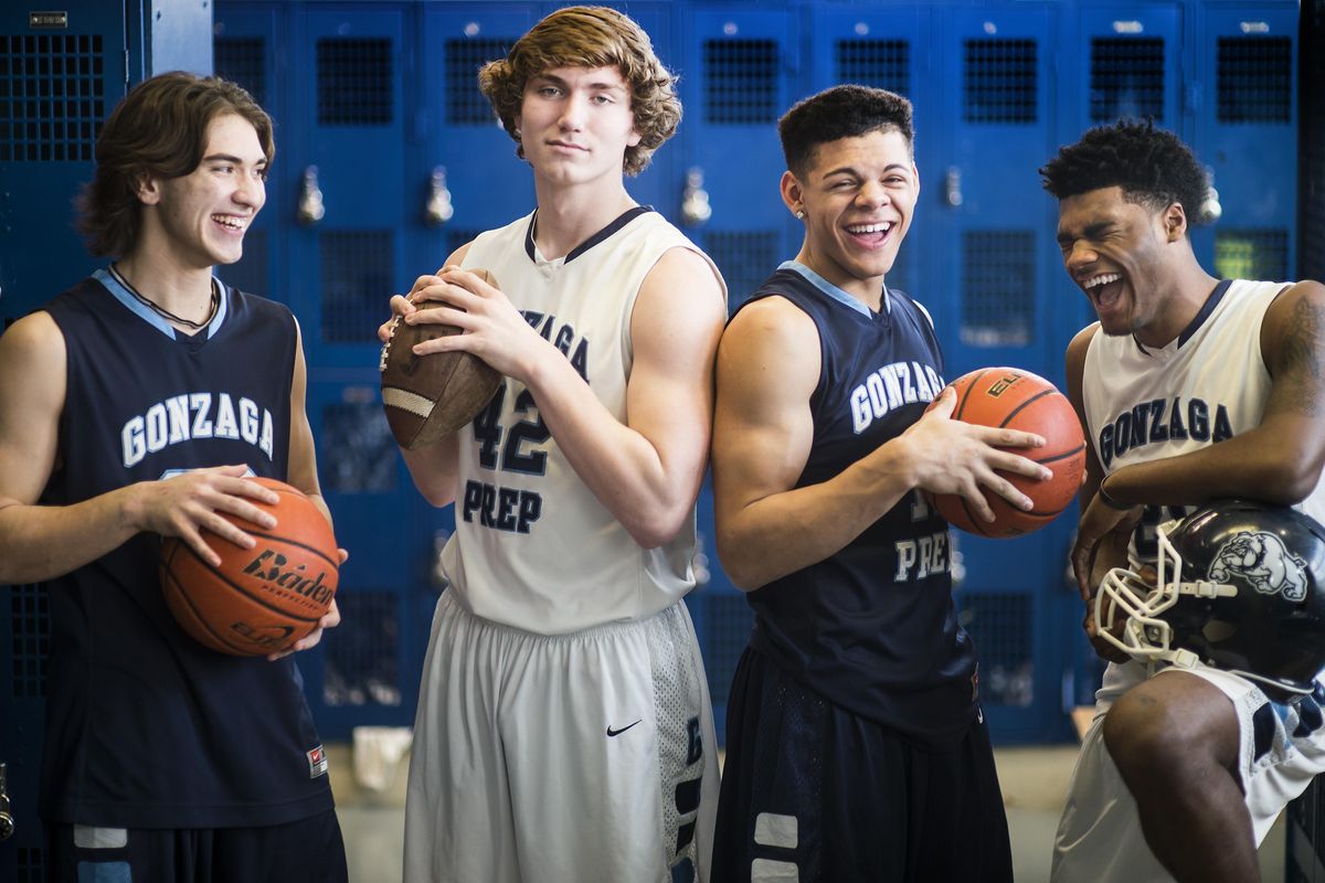 Left to right, Kea Vargas, Shane Eugenio, Sam Lockett and Devin Culp all played on a state championship football team and now have their sights set on the state basketball championship. (Colin Mulvany / The Spokesman-Review)
