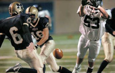 
Gonzaga Prep's Pat Enders (53) blocks a Mead punt by Chad Loncosty Friday at Albi Stadium. Mead won 28-27. 
 (Brian Plonka / The Spokesman-Review)