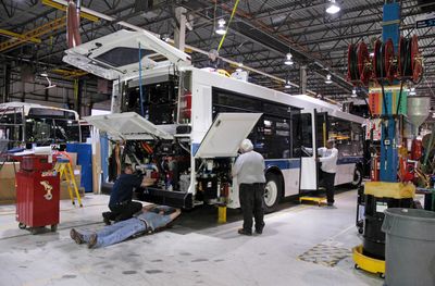 Workers assemble new, cleaner-burning buses Wednesday at the Daimler Buses North America facility in Oriskany, N.Y.  Washington is paying hundreds of millions of dollars for the new buses, one of the $787 billion stimulus plan programs.  (Associated Press / The Spokesman-Review)