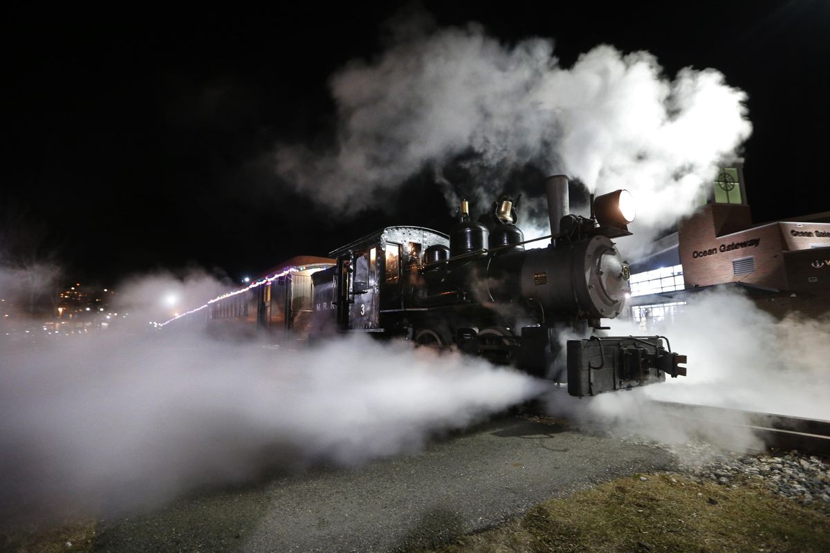 Steam shoots out from a 1913 steam locomotive as the Polar Express begins it’s journey to the “North Pole” on the Maine Narrow Gauge Railroad , in Portland, Maine. The popular train ride, based on the well-known children’s book, has rides scheduled throughout the holiday season. Passengers ride about a mile and a half along Casco Bay on the Eastern Promenade to the North Pole. (Robert Bukaty / Associated Press)