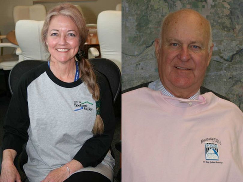 Spokane Mayor Mary Verner, left, and Spokane Valley Mayor Tom Towey wear shirts from each other's jurisdictions as part of a bet over the returns on the U.S. Census.