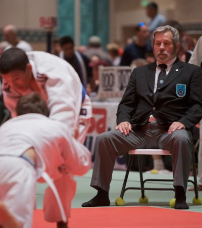 USA Judo official Fletcher Thornton watches a match  during the USA Judo National Junior Olympic Championships. For the New York Times (Chris Livingston For the New York Times / The Spokesman-Review)
