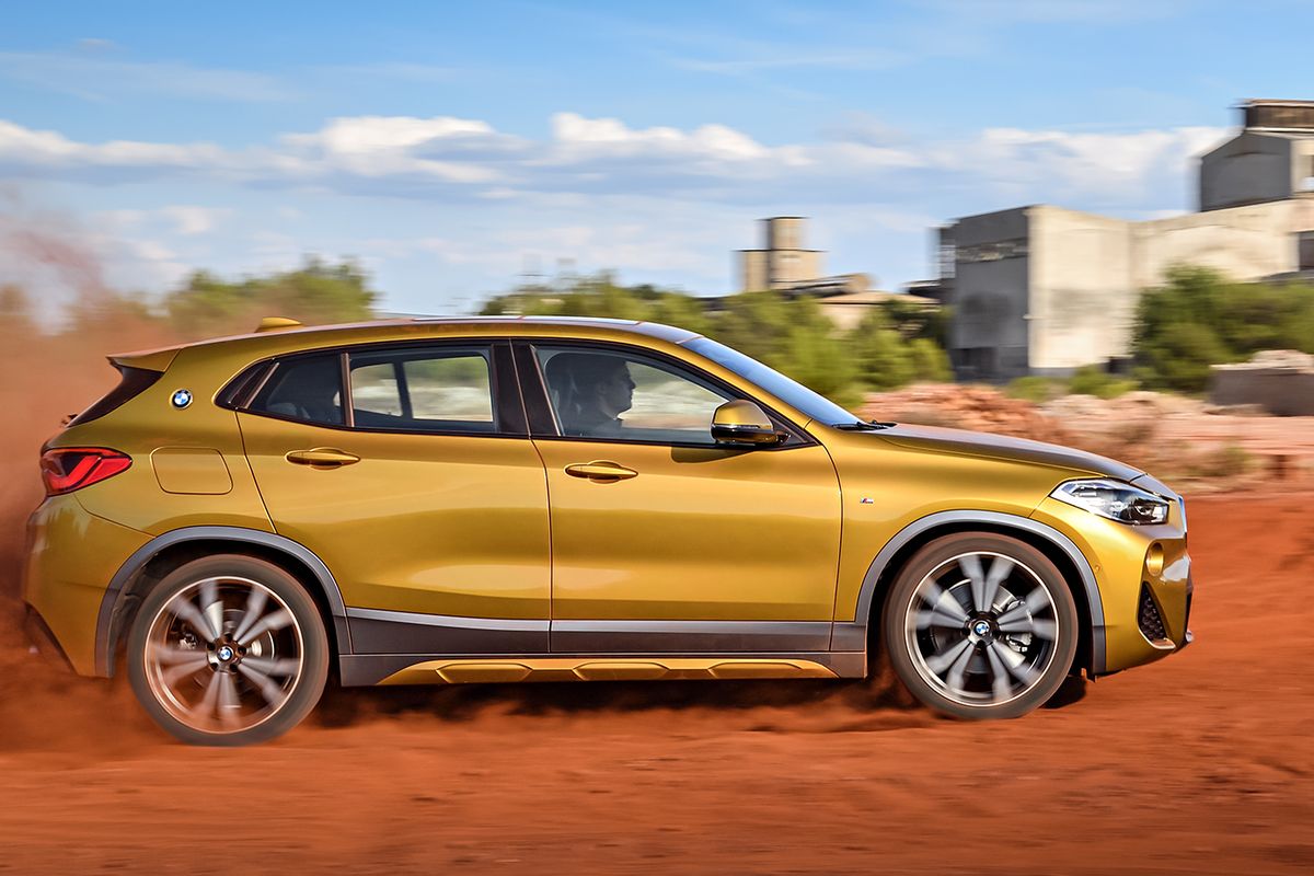 The tapering roof and rising shoulder line perform a pas de deus that draws the eye rearward where they come together at a thick C-pillar. (BMW)