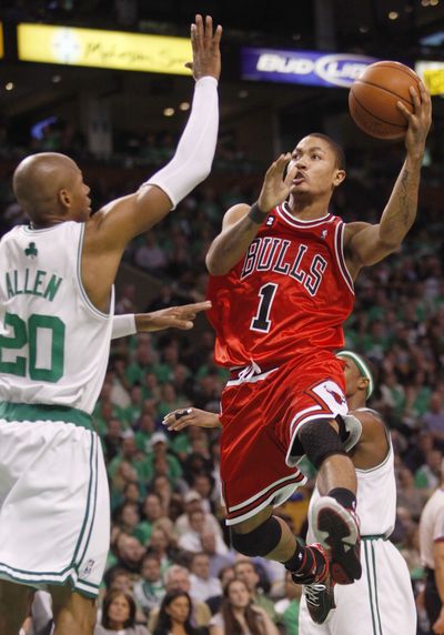 Chicago rookie guard Derrick Rose drives against Boston’s Ray Allen.  (Associated Press / The Spokesman-Review)