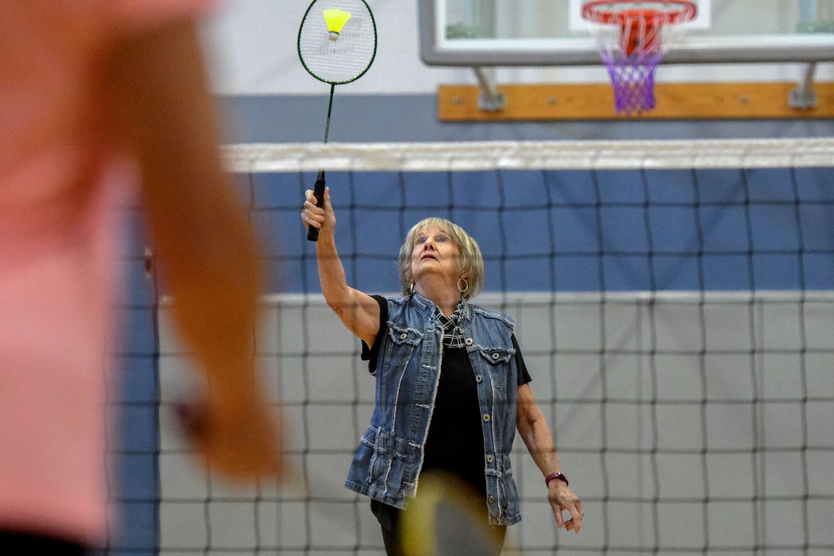 Merry Young eyes a shot during a badminton game with the Netchix at Focused Fitness Community Center in Spokane Valley on Wednesday.  (Kathy Plonka/The Spokesman-Review)