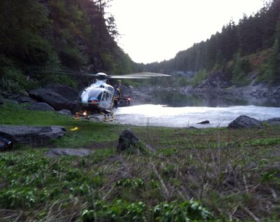 A MedStar helicopter lands in cramped quarters Saturday on the shore of Emerald Lake in Hoodoo Canyon in the Colville National Forest.
