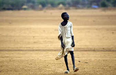 
A young refugee walks near the Abu Shok refugee camp outside El Fasher, Friday in western Sudan. 
 (Associated Press / The Spokesman-Review)