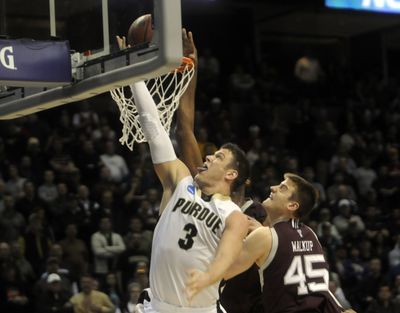 Purdue’s Chris Kramer drives and hits the winning layup in overtime. The Boilermakers are in the Sweet 16 for the second straight year.bartr@spokesman.com (J. BART RAYNIAK)