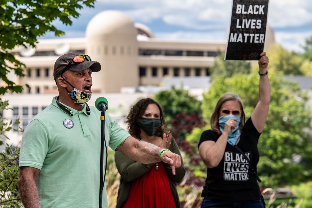 Kurtis Robinson, president of the Spokane chapter of the NAACP, denounces the city's proposed contract with the Spokane Police Guild on Monday, June 29, 2020, during a protest outside City Hall.  (Colin Mulvany / The Spokesman-Review)