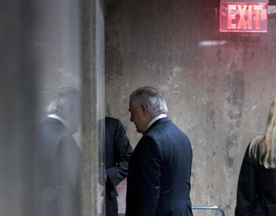 Secretary of State Rex Tillerson walks down a hallway after speaking at a news conference Tuesday, March 13, 2018, at the State Department in Washington. President Donald Trump fired Tillerson and said he would nominate CIA Director Mike Pompeo to replace him, in a major staff reshuffle just as Trump dives into high-stakes talks with North Korea. (Andrew Harnik / AP)