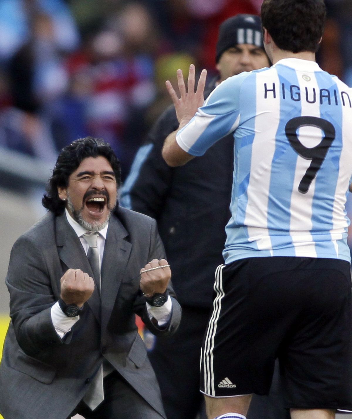 Argentina head coach Diego Maradona, left, congratulates Gonzalo Higuain during the World Cup group B soccer match between Argentina and South Korea at Soccer City in Johannesburg, South Africa. Argentina won 4-1. (Ivan Sekretarev / Associated Press)