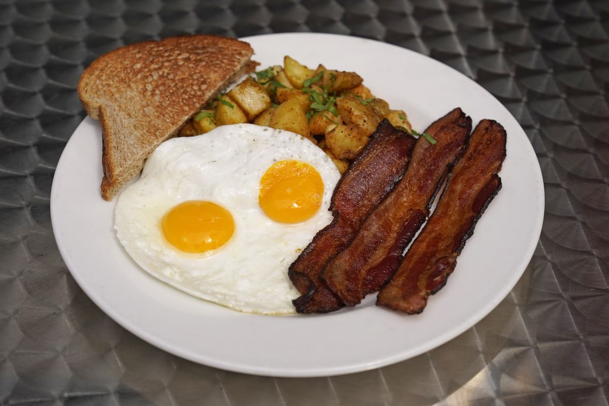 Eggs are high in dietary cholesterol, but foods high in saturated fat – like bacon and buttered toast – do more to raise cholesterol levels in the blood than foods high in dietary cholesterol.  (Eric Risberg/Associated Press)