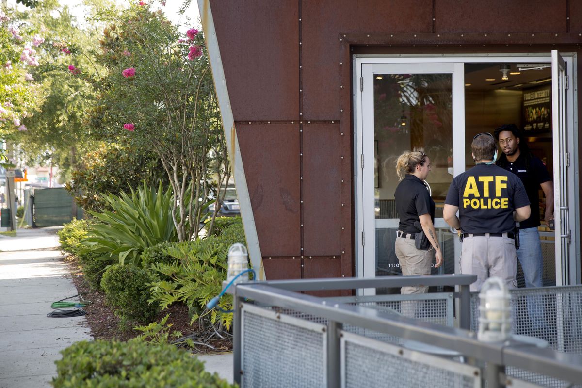 Bureau of Alcohol Tobacco and Firearms agents on Wednesday, June 15, 2016, approach a business as it prepares to open for the first time since the mass shooting at a nightclub a few blocks away in Orlando, Fla. (David Goldman / Associated Press)