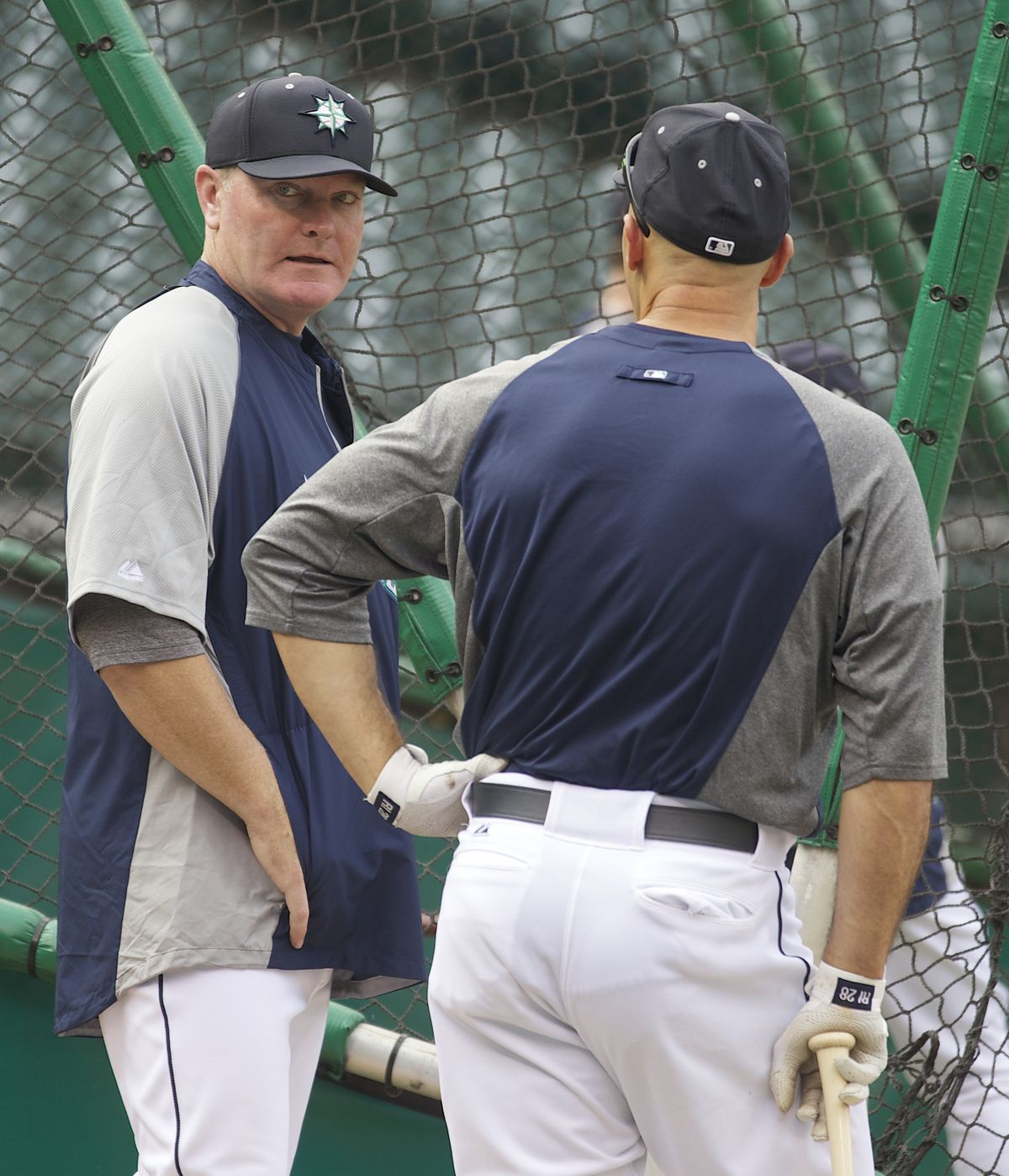 Mariners manager Eric Wedge, left, talks with Raul Ibanez during batting practice before Friday’s game. (Associated Press)