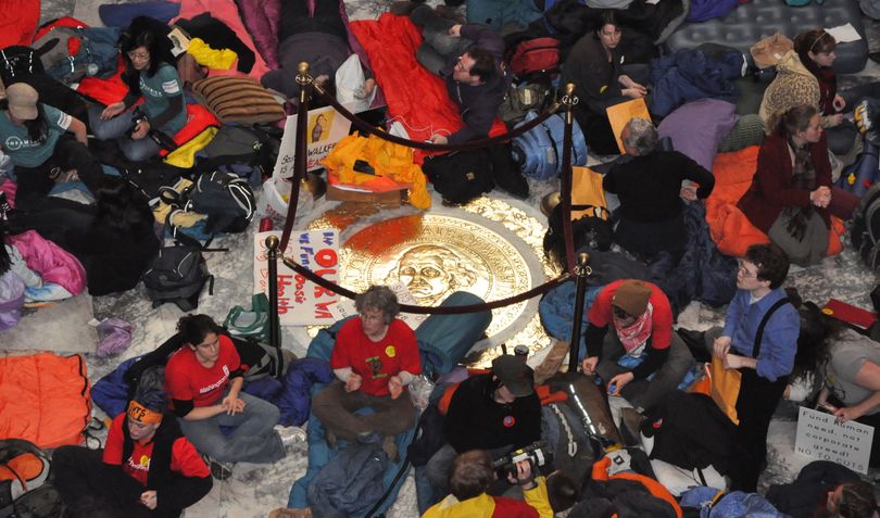 Protesters prepare for a night in the Capitol with sleeping bags laid out on the Rotunda floor. (Jim Camden/The Spokesman-Review)