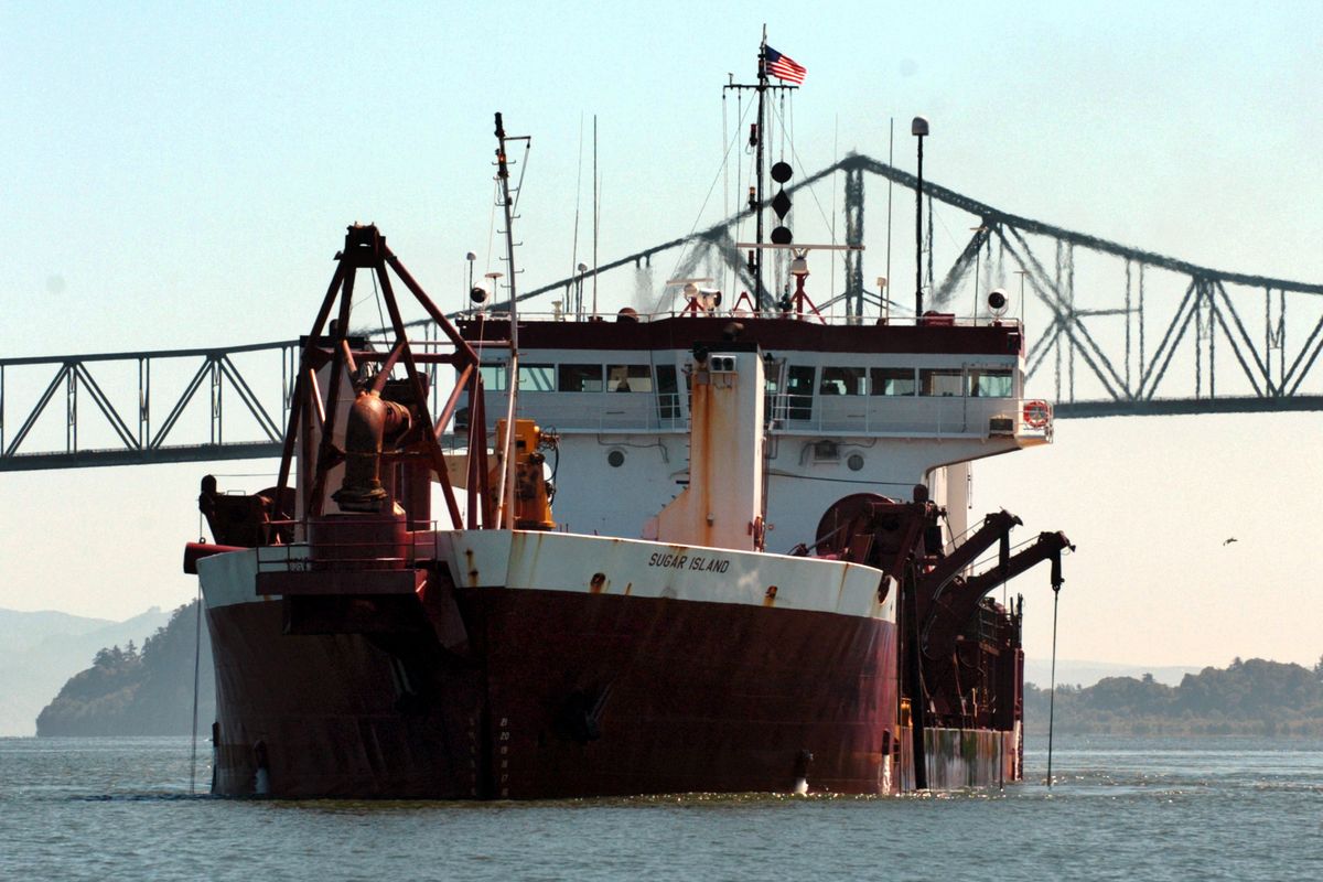 The Sugar Island dredges the Columbia River shipping channel in June 2006, near Astoria, Ore. (Associated Press)