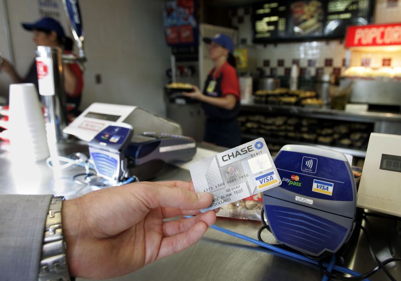 Americans are feeling more confidence in the economy, and in turn are increasing their willingness to use credit to make purchases. The first increase in credit-card debt since the financial crisis hit helped to boost overall consumer borrowing 3 percent in December. (Associated Press)