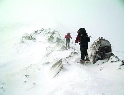 
A requirement for climbers to wear locator beacons may have aided search and rescue volunteers in December during their futile attempt to find three climbers before they died.
 (Associated Press / The Spokesman-Review)