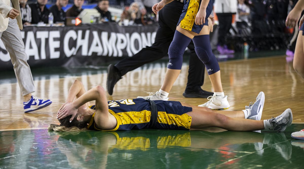 Mead guard Teryn Gardner falls to the ground at the buzzer after attempting the game-tying shot that came up short during action in the Championship game of the 3A Girls State Basketball Tournament in Tacoma, Wash., on Saturday, March 2, 2024. Gardner had a team-high 22 points but Mead fell to Garfield 62-59.  (Patrick Hagerty/For The Spokesman-Review)