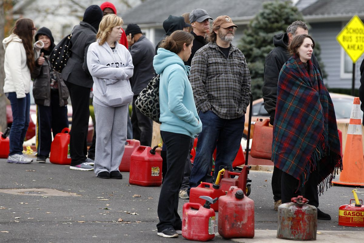 Residents of Keyport, N.J., wait in line to buy gasoline from a Shell station on Thursday. (Associated Press)