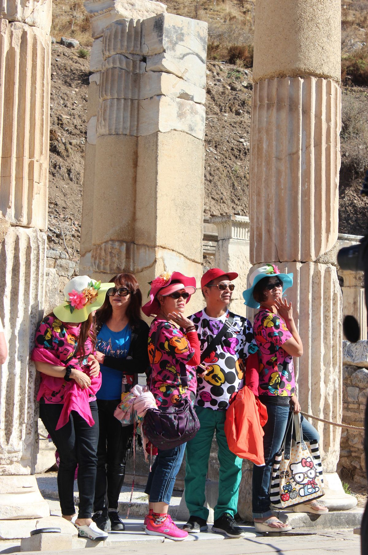 Above: Tourists from all over the world pose for pictures among the ruins in Ephesus, Turkey