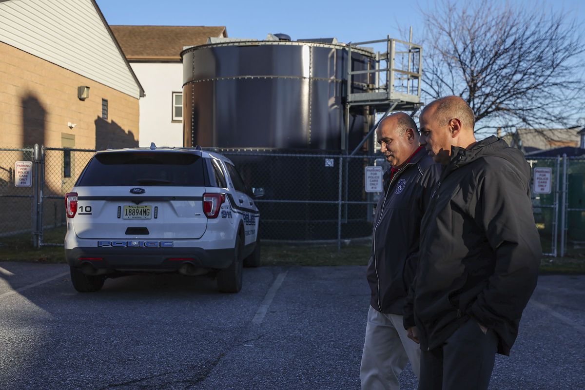 John Giovannitti, left, mayor-elect of Paulsboro, and brother Vince Giovannitti, mayor of Gibbstown, walk outside of the Greenwich Township Municipal Building.   (Heather Khalifa/The Philadelphia Inquirer/TNS)