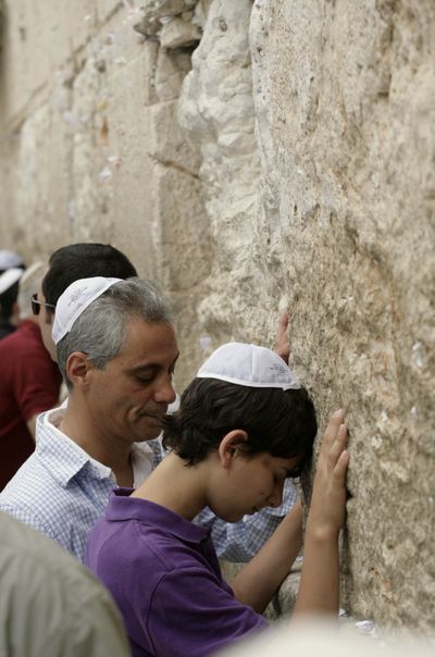 White House Chief of Staff Rahm Emanuel and his son Zach pause at Jerusalem’s Western Wall  Thursday.  (Associated Press)
