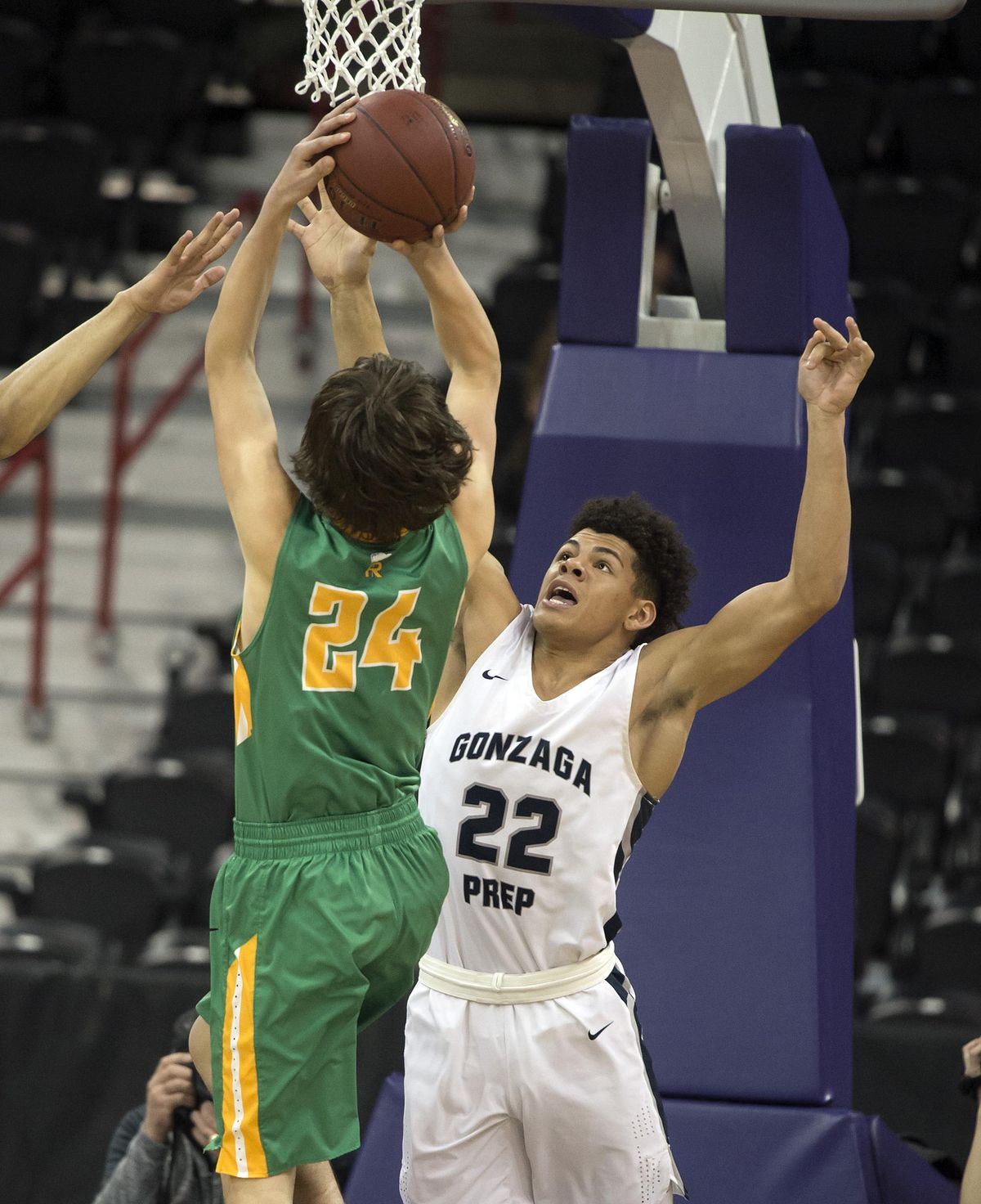 Gonzaga Prep guard Sam Lockett (22) tries to stop a shot by Richland’s Cole Northrop (24) during a District 4A title basketball game, Friday, Feb. 16, 2018, in the Spokane Arena. (Colin Mulvany / The Spokesman-Review)