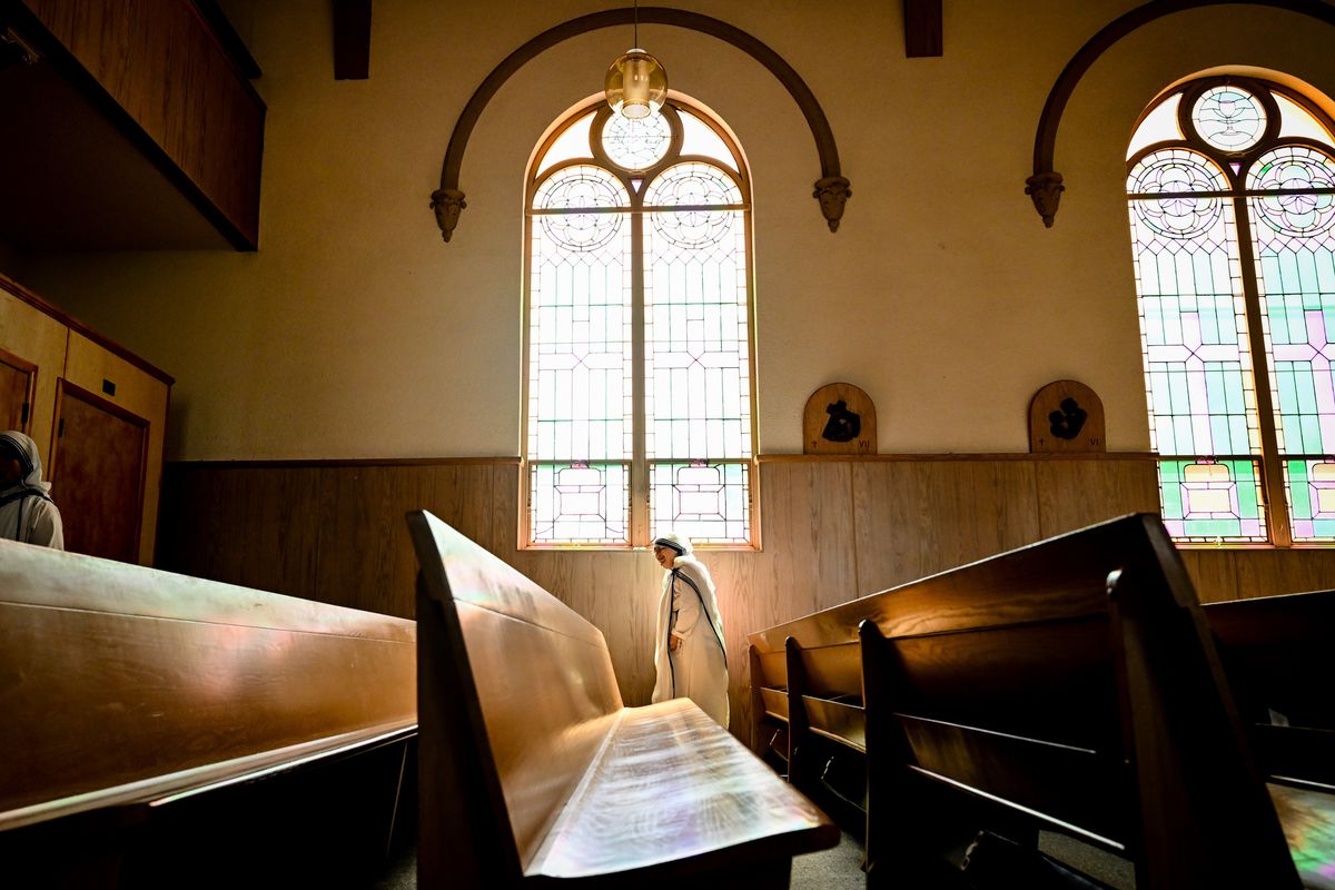 A sister from the Missionaries of Charity smiles as she walks through Hillyard’s historic St. Patrick Catholic Church on May 21 in Spokane.  (Tyler Tjomsland/THE SPOKESMAN-REVIEW)