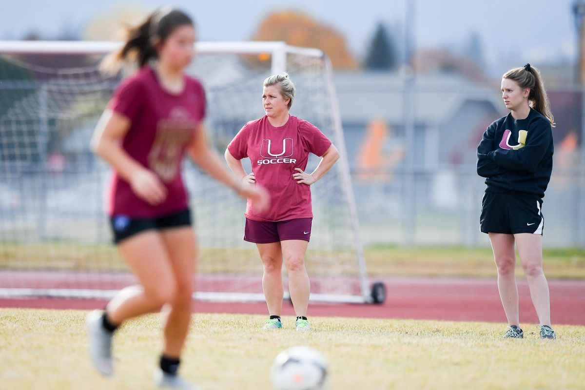 University High School soccer coach Kara Sharpe center watches her team from the sidelines during practice Tuesday, Oct. 23, 2018, at University High School in Spokane Valley, Wash. (Tyler Tjomsland / The Spokesman-Review)