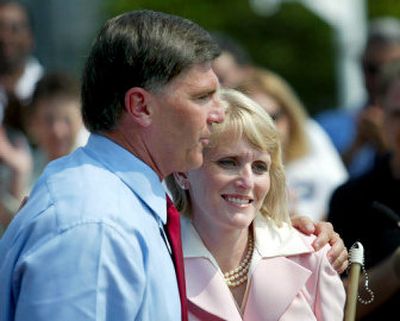 
Maryland Gov. Robert Ehrlich and running mate Kristen Cox, who is legally blind, hug Thursday in Annapolis, Md., after announcing her bid for the lieutenant governor's seat in this year's election.
 (Associated Press / The Spokesman-Review)