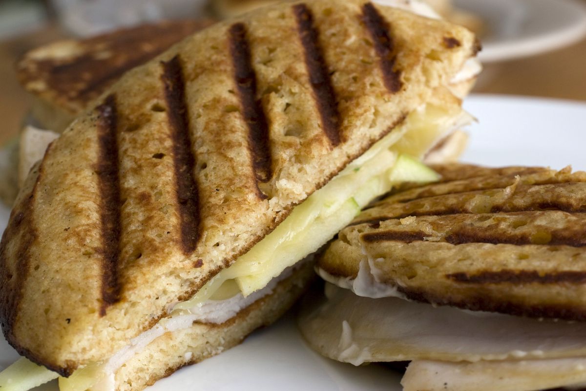 A Pancake Panini sandwich, left, and Sausage Pita Pockets are two quick meals that can be prepared in the morning with leftovers from breakfast. (The Spokesman-Review)