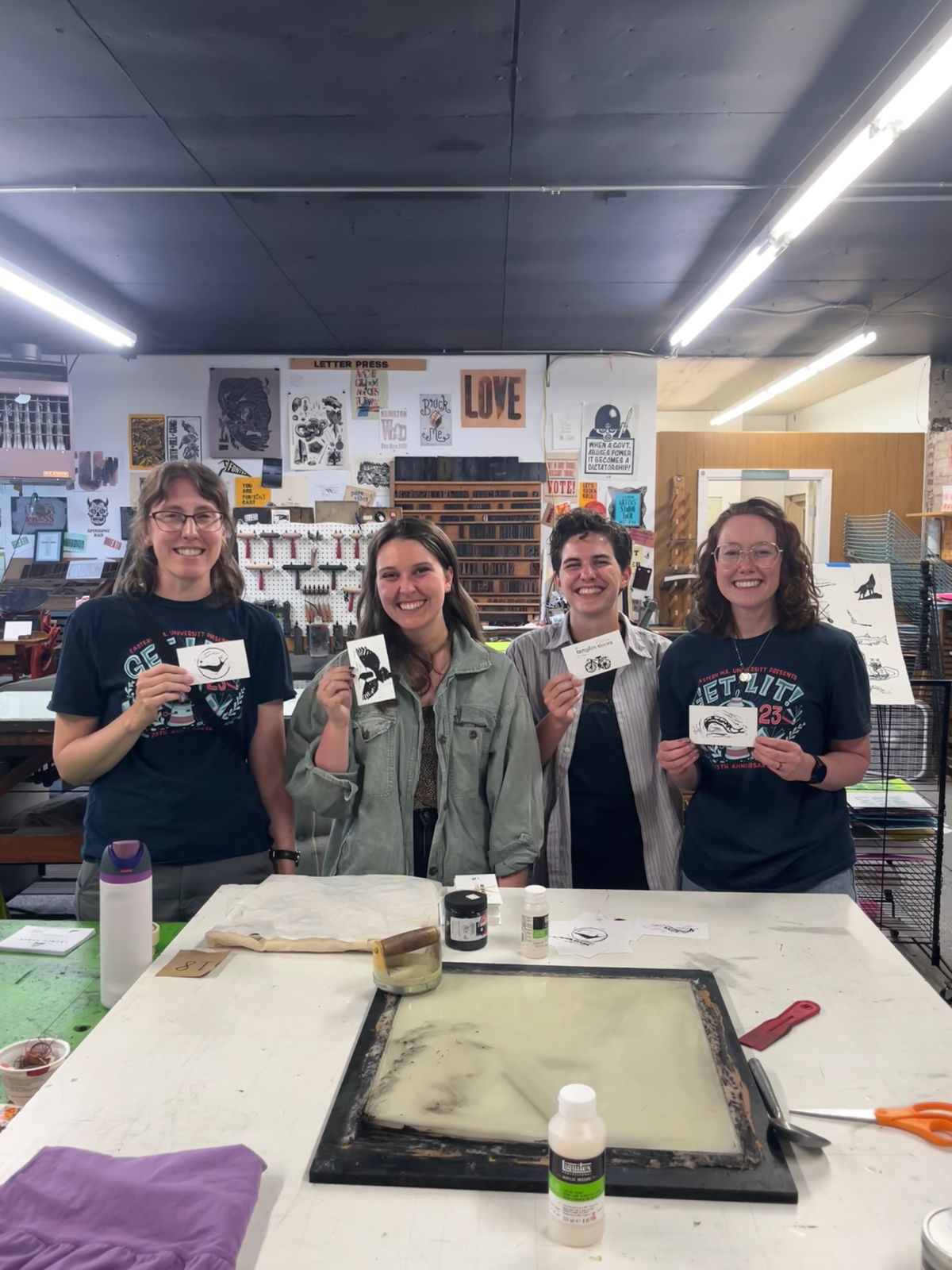 Katy Shedlock, left, Morganne Elkins, Dylan Cooper and Aimee Brooks pose with their block creations at a print party. The four are part of Banana Slug Books, which is releasing its first book, “Spokane Campfire Stories,” this weekend.  (Courtesy)