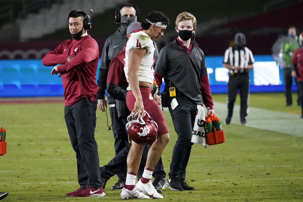 Washington State quarterback Jayden de Laura walks off the field after an injury during the second half against Southern California in Los Angeles on Sunday.  (Associated Press)