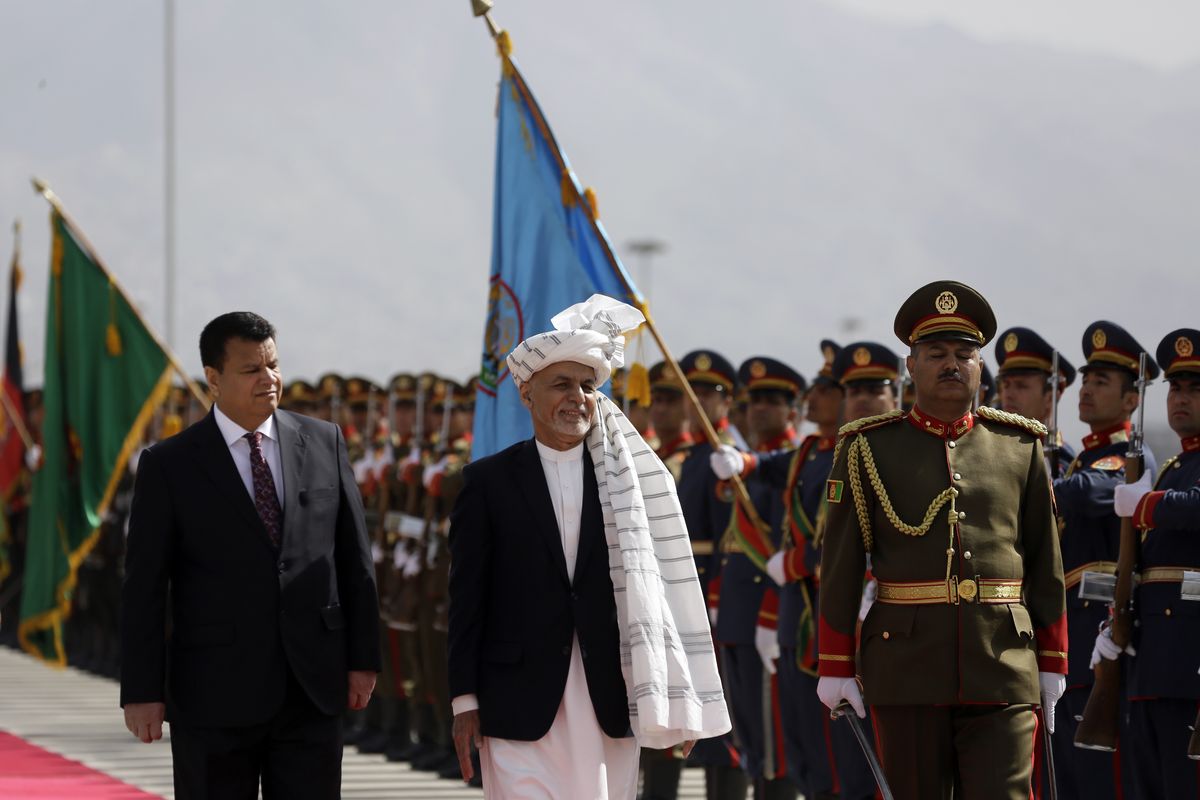 In this March 6, 2021 photo, Afghan President Ashraf Ghani, center, inspects an honor guard during the opening ceremony of the new legislative session of the Parliament, in Kabul, Afghanistan. Afghanistan’s embattled president left the country Sunday, Aug. 15, 2021, joining his fellow citizens and foreigners in a stampede fleeing the advancing Taliban and signaling the end of a 20-year Western experiment aimed at remaking Afghanistan.  (Mariam Zuhaib)