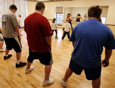 
Teenagers and children participate in an aerobics class at the Windber Medical Center in Windber, Pa. A study released today emphasized that people must continually watch their weight to avoid becoming obese.
 (File/Associated Press / The Spokesman-Review)