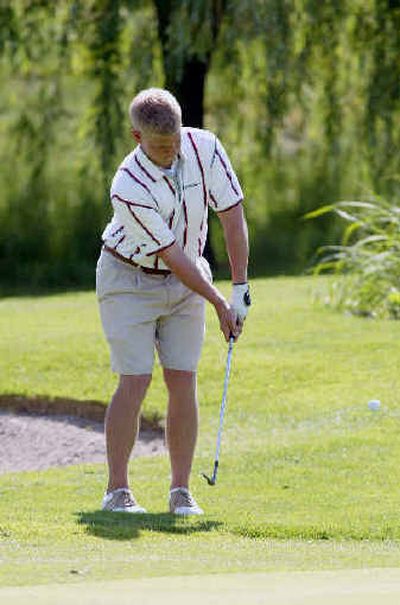 
Ferris golfer Craig Leslie chips onto the 11th green during 4A action.Ferris golfer Craig Leslie chips onto the 11th green during 4A action.
 (Photo courtesy of the Tri-City HPhoto courtesy of the Tri-City H / The Spokesman-Review)