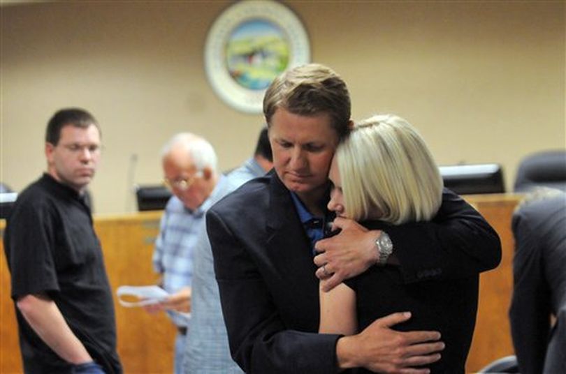 Sen. John McGee shares a moment with his wife Hanna following a meeting of the Canyon County Republicans on Tuesday, July 12, 2011 at the Canyon County Courthouse in Caldwell, Idaho. McGee delivered an apology for his actions which led to his June 19 arrest and guilty plea for drunken driving. (AP Photo/Idaho Press-Tribune / Charlie Litchfield)