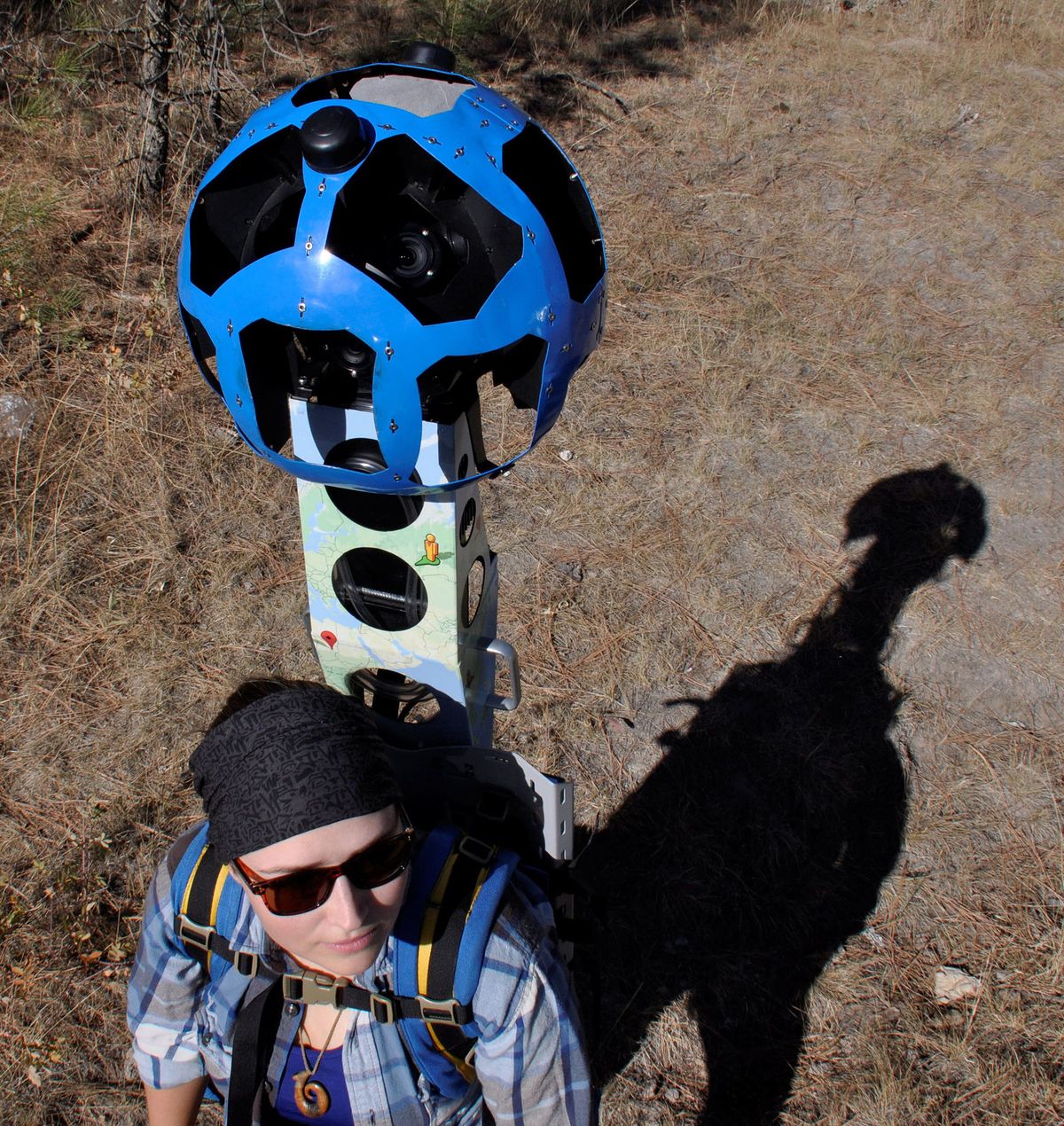 Volunteer Katherine Beal shoulders the 46-pound Google Trekker camera system as she hikes a trail in Riverside State Park. (Rich Landers)