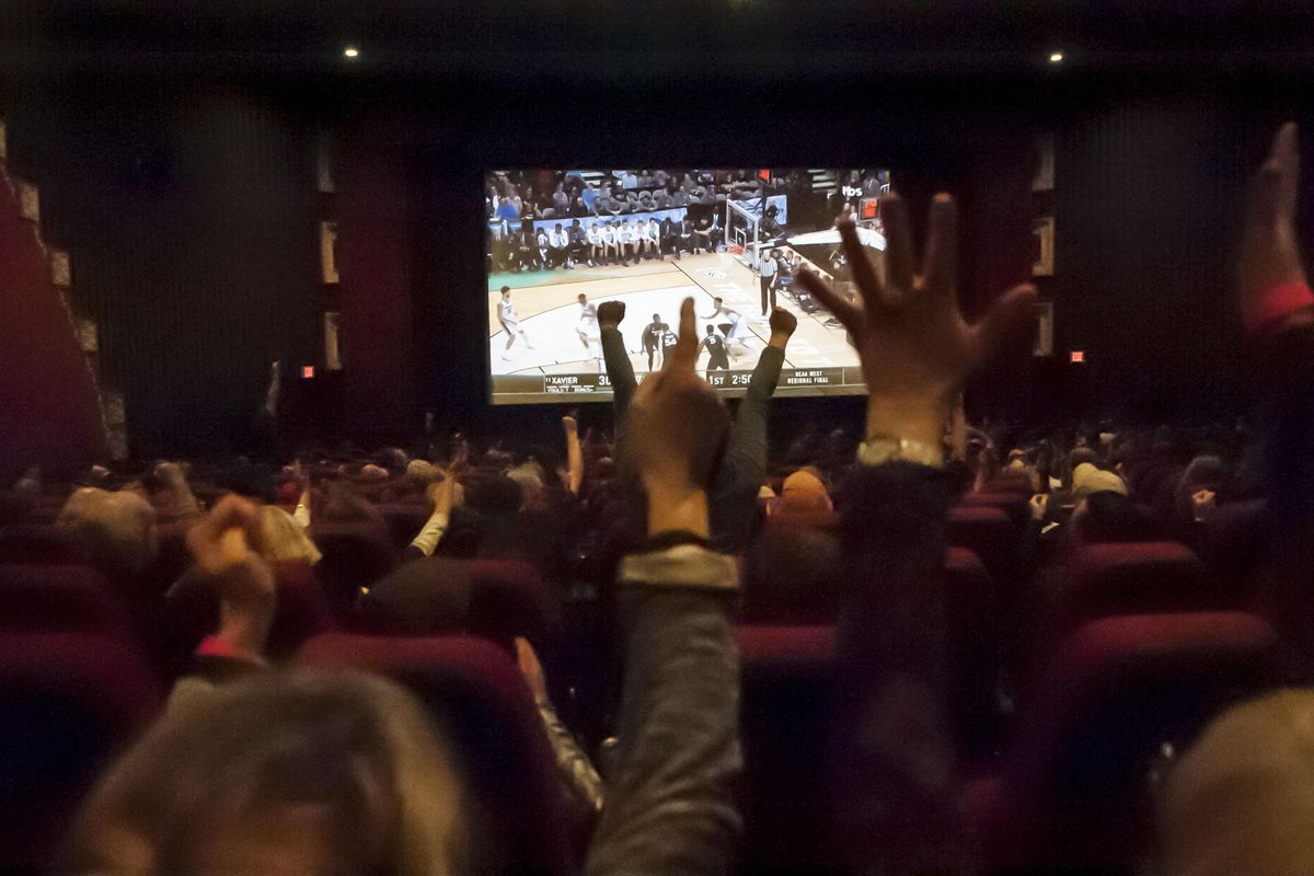 The Garland Theater offered free admission as they aired the Gonzaga v. Xavier game on Saturday. Gonzaga students also watched the match from campus. (Kathy Plonka / The Spokesman-Review)