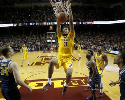 Minnesota’s Jordan Murphy (3) dunks during an NCAA college basketball game against Michigan, Sunday, Feb. 19, 2017, Minneapolis. (Carlos Gonzalez / Associated Press)
