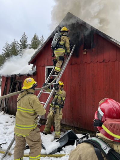 Firefighters work to extinguish a house fire Monday on U.S. Highway 2 between Diamond Lake and Newport. Firefighters found one person dead in the home.   (Courtesy of South Pend Oreille Fire and Rescue)