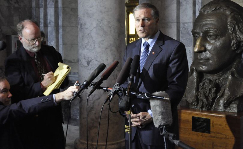 OLYMPIA -- Gov. Jay Inslee holds a press conference in a Capitol Hallway to call for support for a package of legislation to secure Boeing's 777X assembly line and production facility. (Jim Camden)