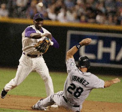 
Arizona's Orlando Hudson completes a double play.
 (Associated Press / The Spokesman-Review)