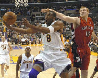 
Kobe Bryant, playing a little less than 42 minutes, scored 81 points Sunday to raise his NBA-leading average to 35.9 points.
 (Associated Press / The Spokesman-Review)