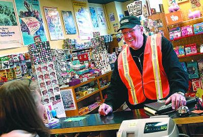An orange vest can be ideal attire for shopping at Boo Radley's, especially if you need to panhandle first, then jaywalk to get there.
(Jed Conklin / The Spokesman-Review)