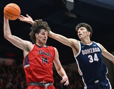 St. Mary's Gaels forward Kyle Bowen (14) snags a rebound against Gonzaga Bulldogs center Chet Holmgren (34) during the second half of a college basketball game on Saturday, Feb 26, 2022, at University Credit Union Pavilion in Moraga, Calif. The St. Mary's Gaels won the game 67-57.  (Tyler Tjomsland / The Spokesman-Review)