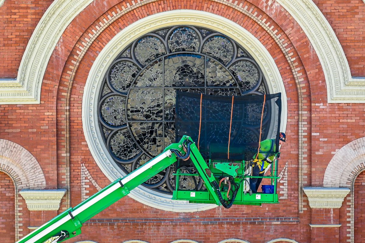 Heath Nevins, of Bovard Studio Stained Glass, takes a momentary break from working on The Cathedral of Our Lady of Lourdes east-side windows, Thursday, July 27, 2023, in Spokane.  (DAN PELLE/THE SPOKESMAN-REVIEW)